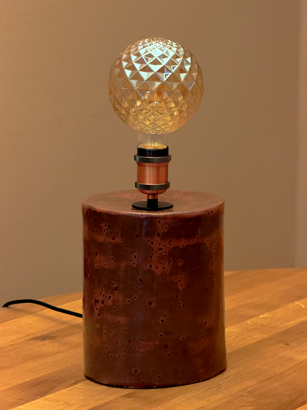 Peppered plum ceramic base with vintage pinecone LED light